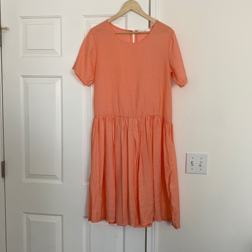 Sign Here Signature Clothing drop waist dress in pastel peach.